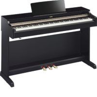 Polished ebony Arius traditional console digital piano with bench